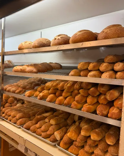 Bread rolls stacked on the bakery shelves