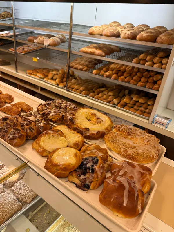 Pastries and bread shelves inside Plaza Pastry Shop