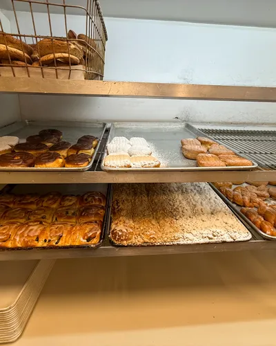 Donuts on trays in the bakery case